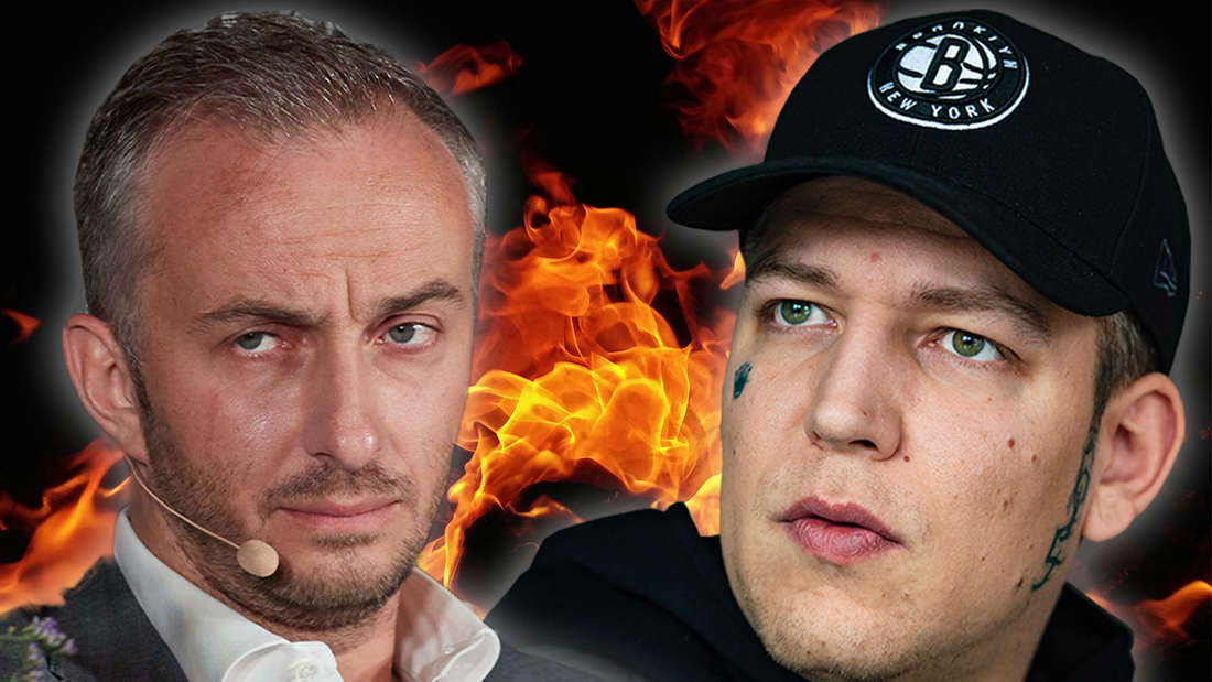 Kritisch blickender Böhmermann und MontanaBlack. Im Hintergrund Flammen